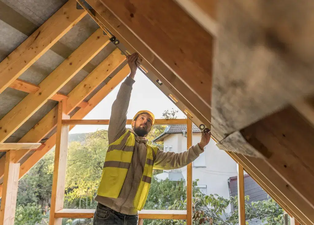 Workman looking at roof
