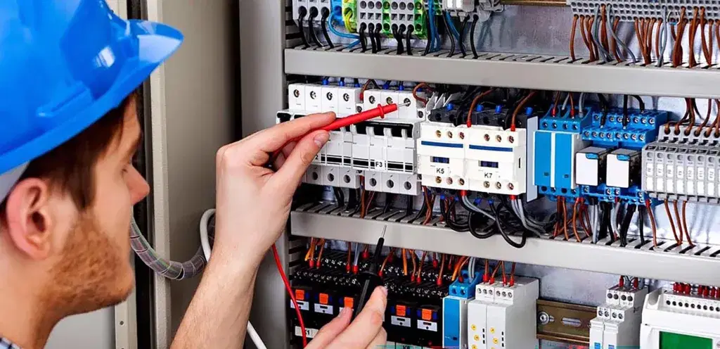 Electrical engineer working on low-voltage systems under BS 7671 Amendment